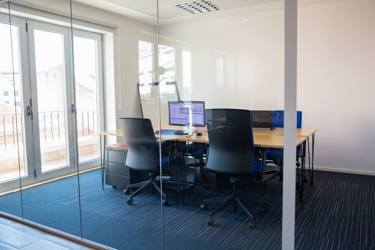 Clean meeting room behind a glass wall in a professional office