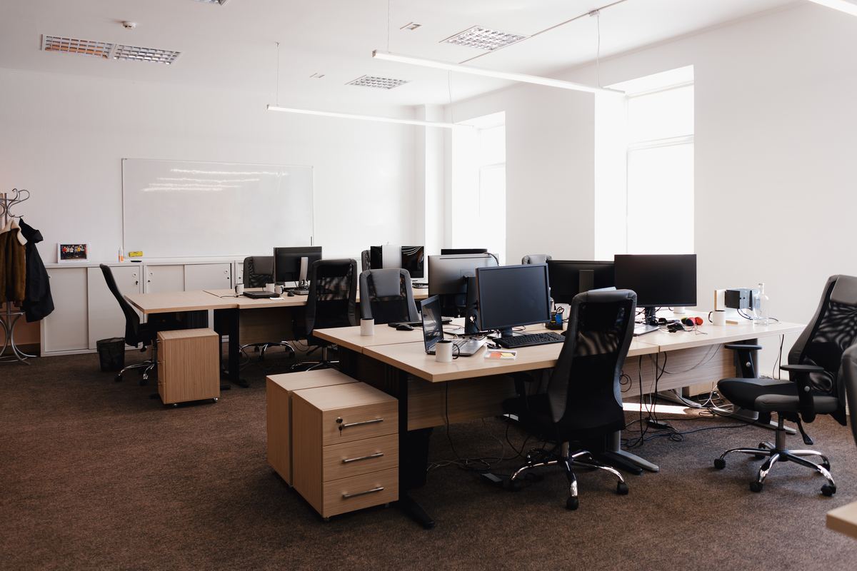 Tidy modern office with clean desks and workstations
