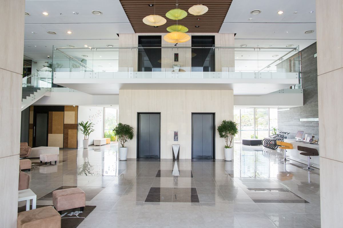 Spotless modern commercial lobby with polished floors and seating