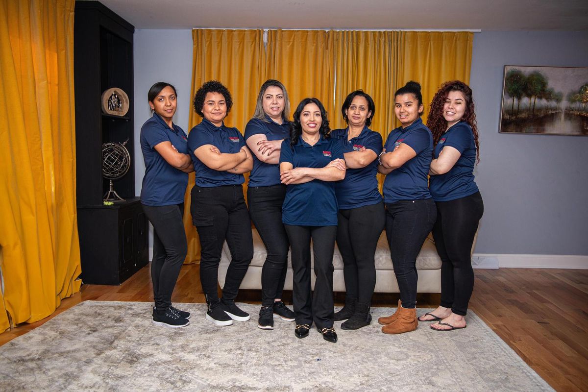 Women of the Maggie's Magic Touch cleaning team