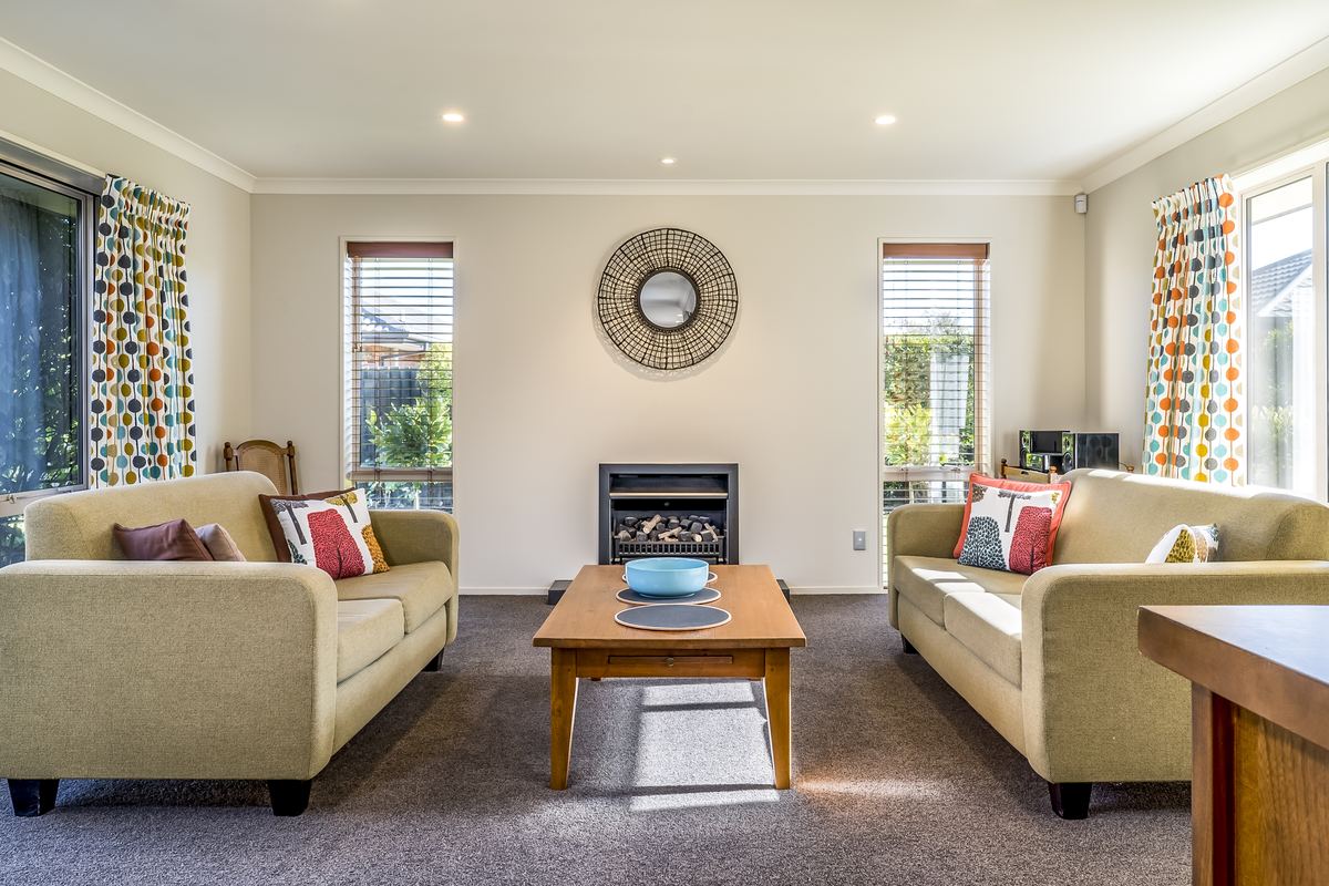 Clean, bright living room with two sofas and a coffee table in a family home