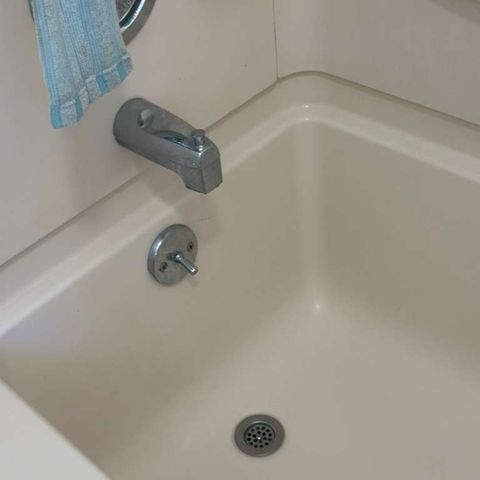 Soap scum and residue removed from a tub (after)